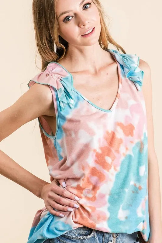 Pink and mint tie-dye knit V-neck top with ruffle detail from Trendsi, featuring a circular design and stylish casual look.