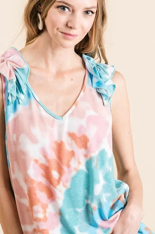Pink and mint tie-dye knit V-neck top with ruffle details, featuring a circular pattern and trendy style from Trendsi.