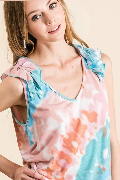 Pink and mint tie-dye knit V-neck top with ruffle details by Trendsi, featuring a circular pattern and stylish design.