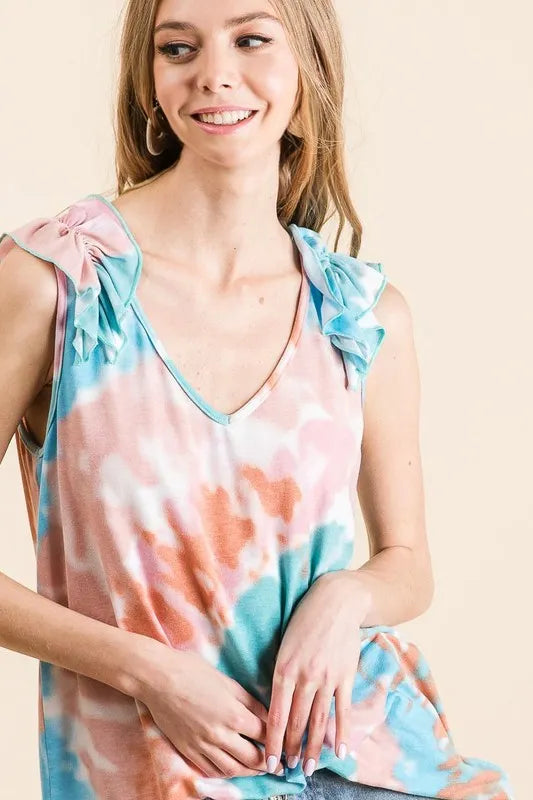 Pink and mint tie-dye knit V-neck top with ruffle details, featuring a circular design and trendy style from Trendsi.