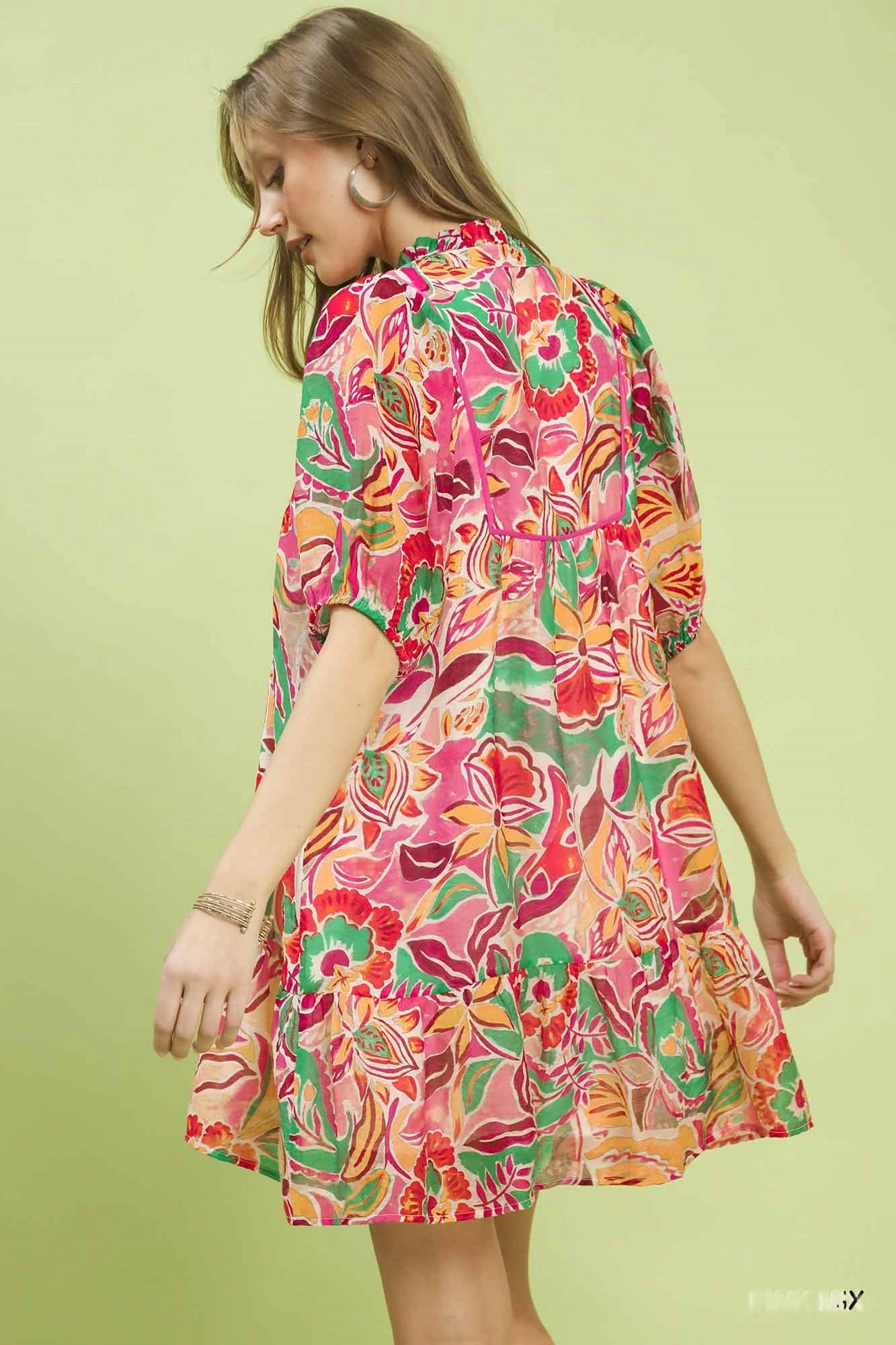 Pink abstract print Umgee baby doll dress with V-neck, featuring a relaxed fit and stylish design for casual wear.