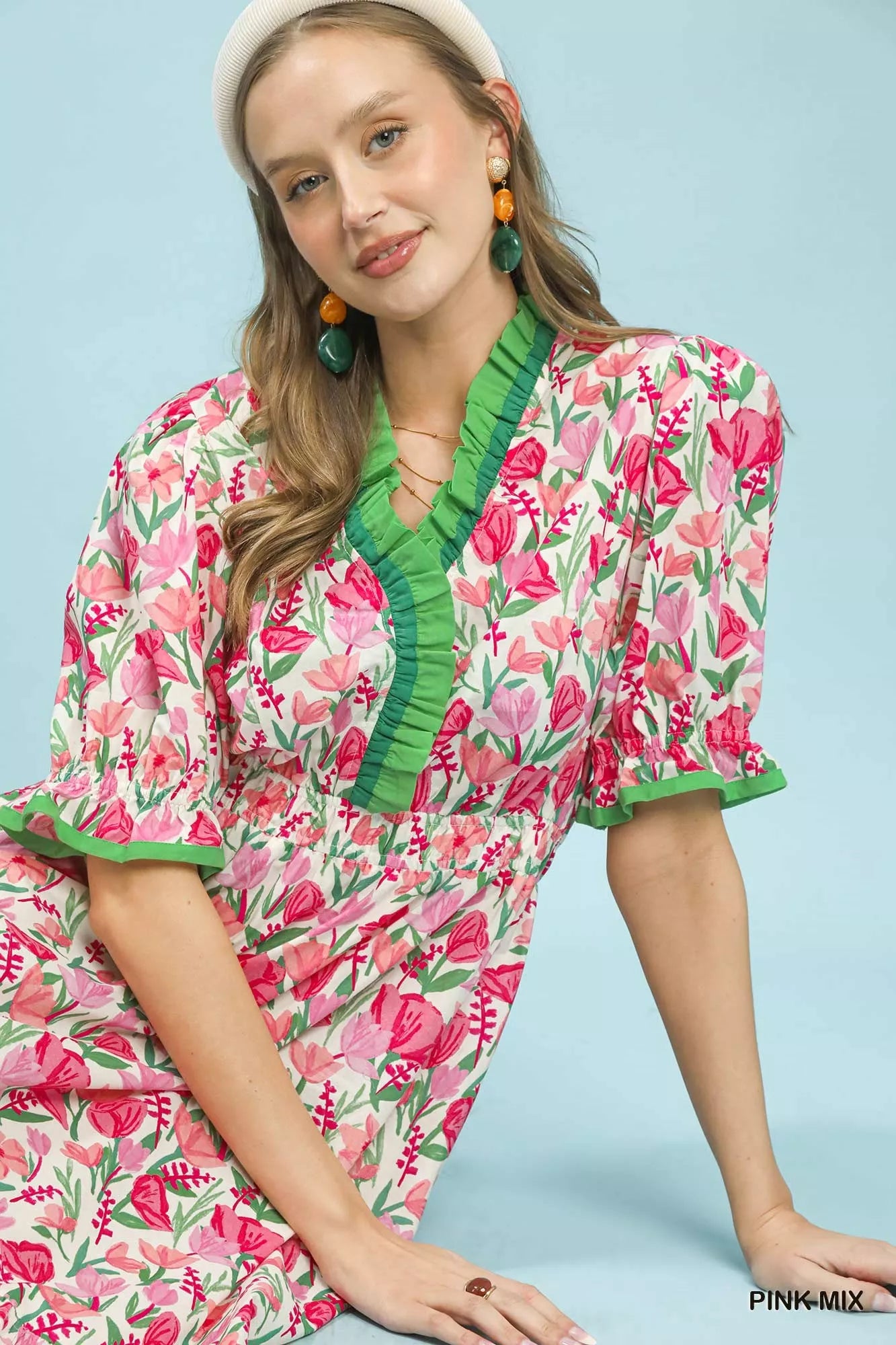 Pink floral ruffle trim tiered midi dress by Umgee featuring a stylish, flowy silhouette and feminine design.