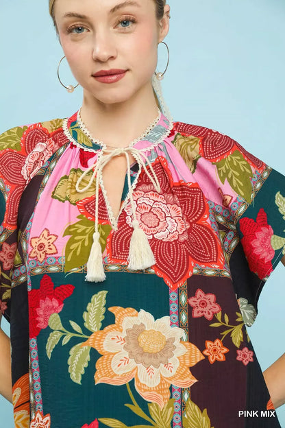 Pink Umgee Mix Floral Patchwork Tassel Tie Top featuring a boho style with floral patterns and tassel details.