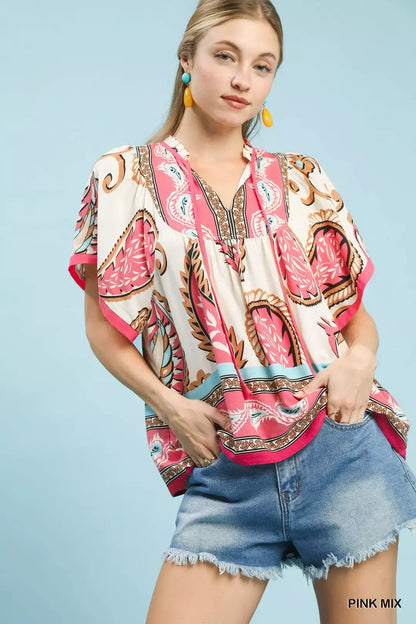 Pink Umgee Mix Paisley Border Print Tassel Top with tassel details and relaxed fit, perfect for boho-inspired style.