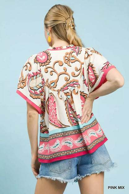 Pink Umgee Mix Paisley Border Print Tassel Top with tassel details and flowy design, perfect for casual or boho styles.