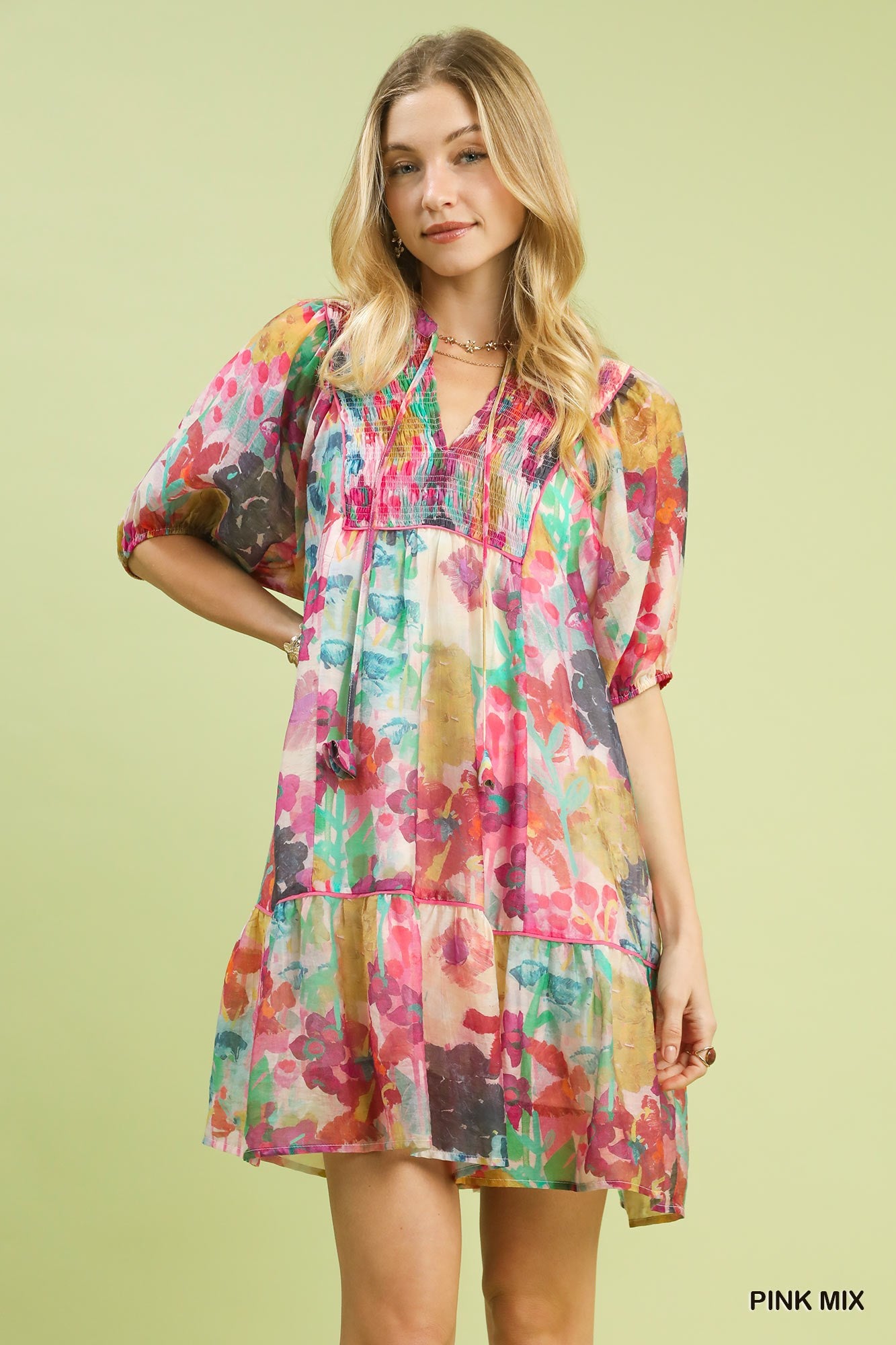 Pink watercolor floral babydoll dress by Umgee, featuring a flowy silhouette and vintage-inspired design.