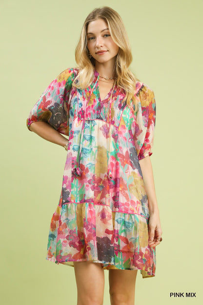 Pink watercolor floral babydoll dress by Umgee, featuring a flowy silhouette and vintage-inspired design.