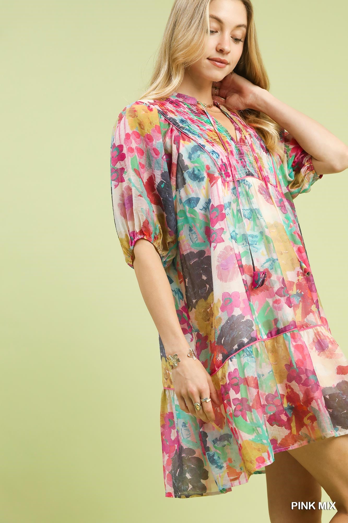 Pink watercolor floral babydoll dress by Umgee featuring a flowy silhouette and delicate floral print.