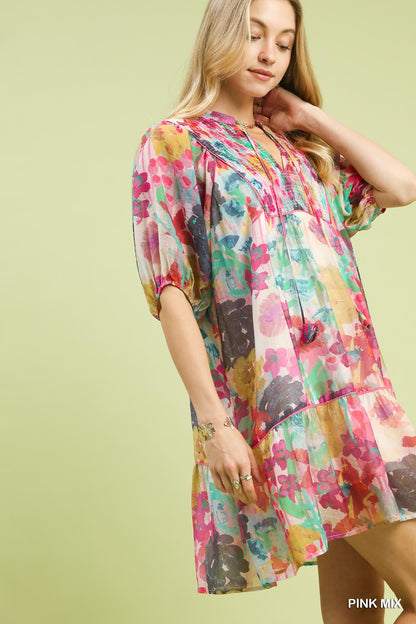 Pink watercolor floral babydoll dress by Umgee featuring a flowy silhouette and delicate floral print.