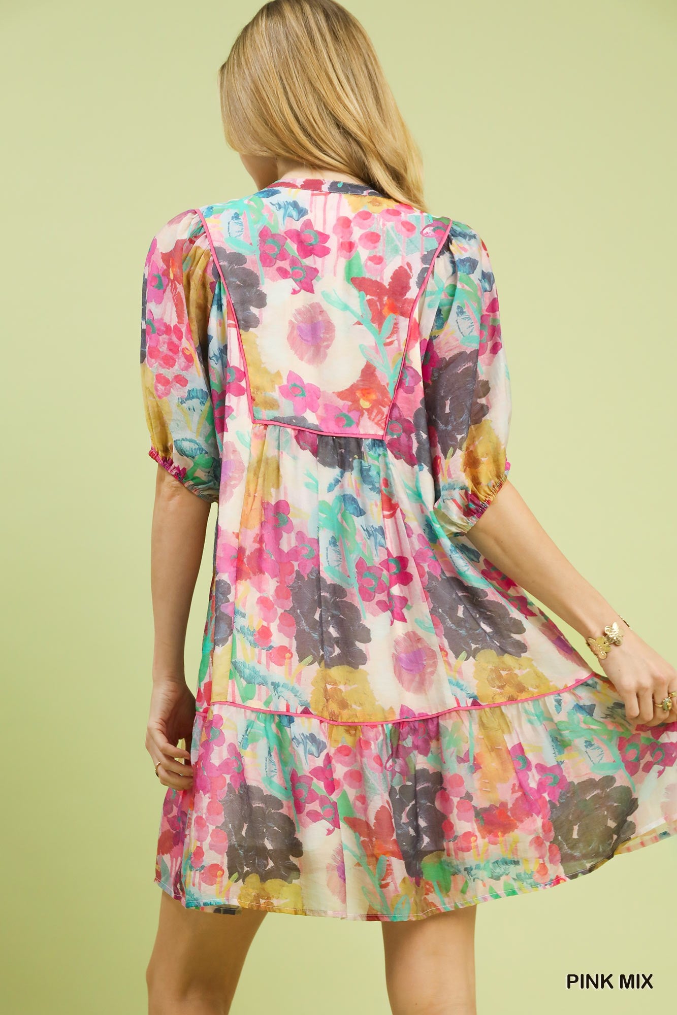 Pink watercolor floral babydoll dress by Umgee featuring a flowy silhouette and delicate floral print.