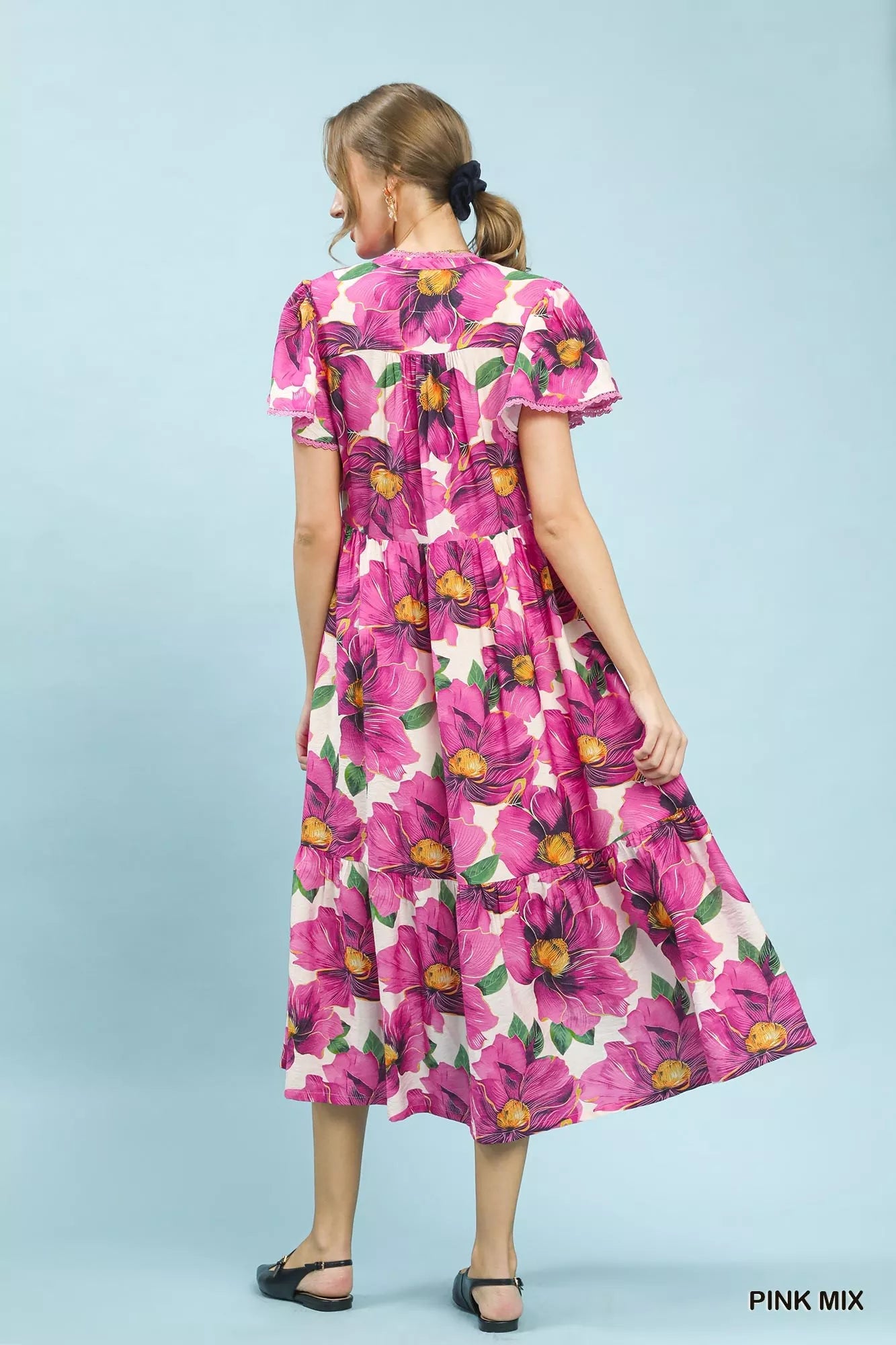 Pink floral V-neck midi dress with flutter sleeves and tiered skirt by Umgee, perfect for tropical-inspired summer looks.
