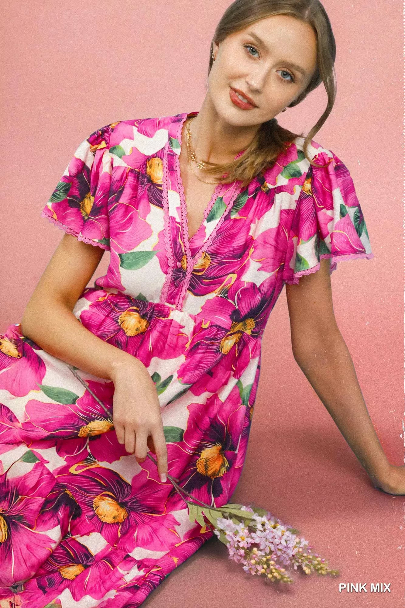Pink floral tiered midi dress with V-neck and flutter sleeves, by Umgee, featuring tropical print and feminine style.