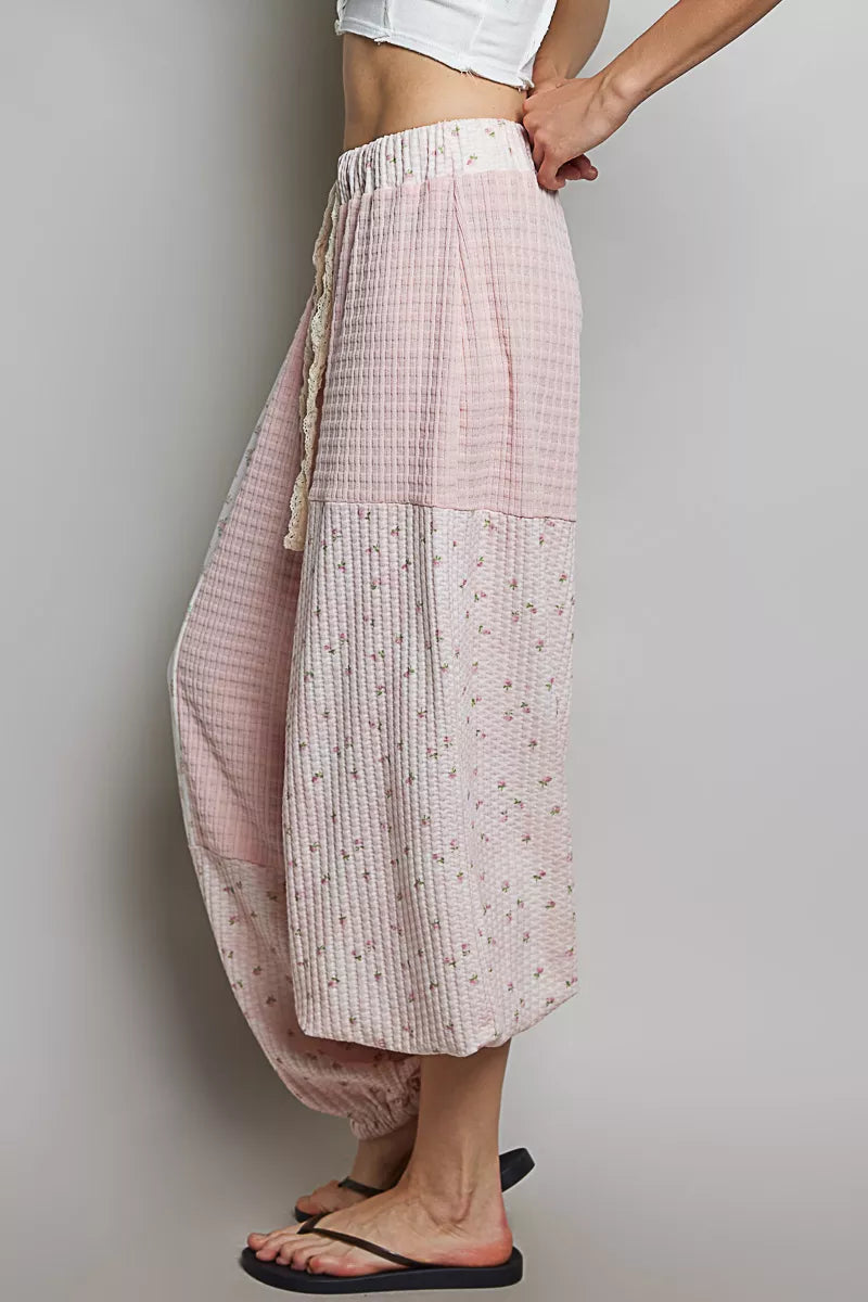 Trendi pink patchwork mixed knit wide-leg pants with a relaxed fit and casual style, perfect for comfortable trendy outfits.