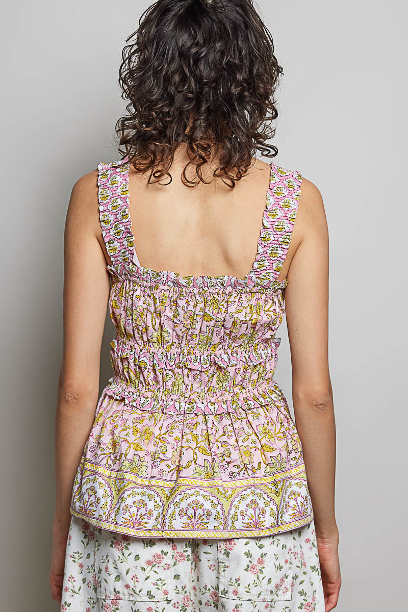 Pink printed POL smocked square neck peplum tank top with ruffle trim from Trendsi, featuring a feminine square neckline and ruffled details.