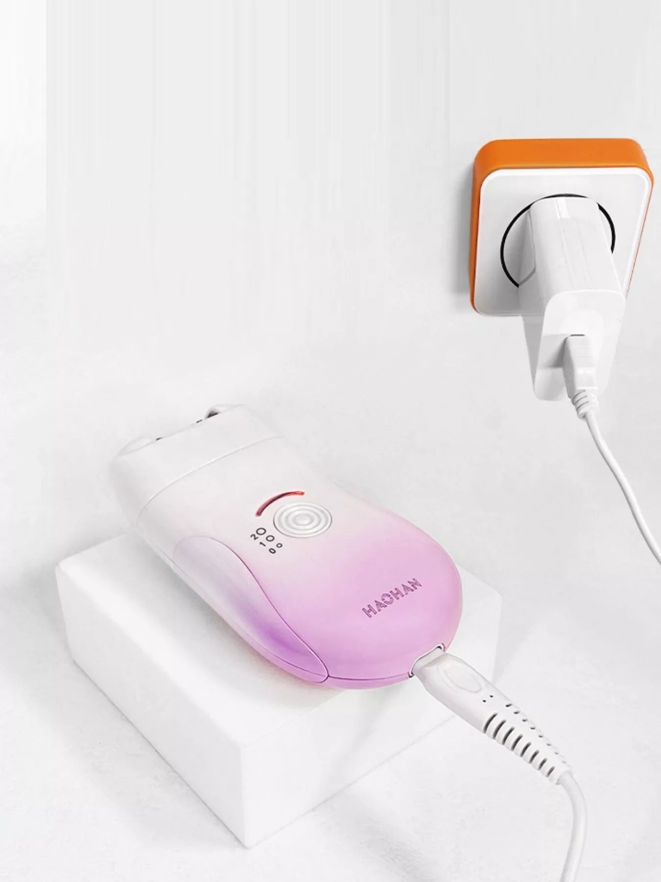 Pink 3-in-1 portable hair removal device by Trendsi with multiple attachments for easy at-home hair removal.
