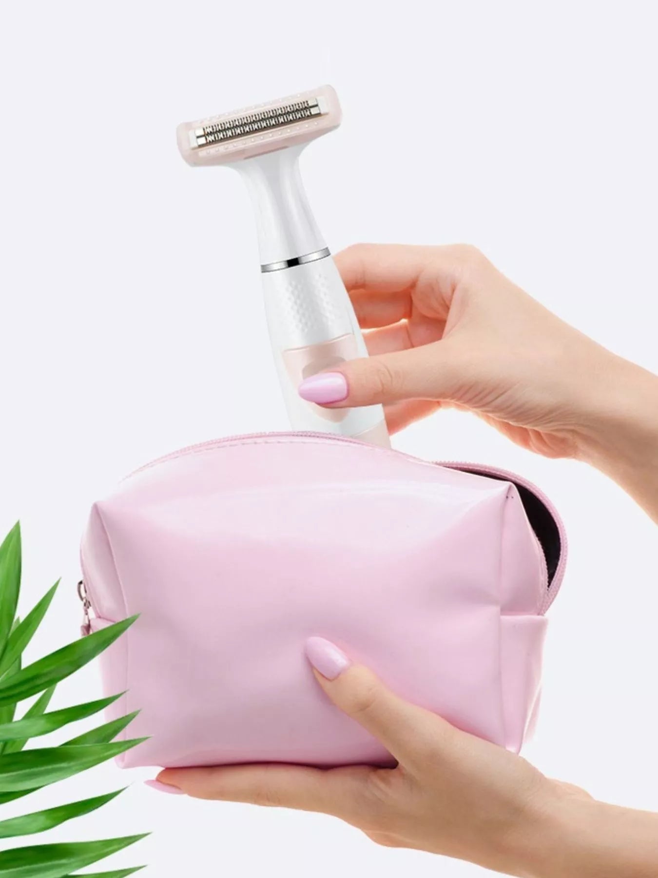 Pink portable hair removal epilator by Trendsi with compact design and multiple attachments for efficient at-home hair removal.
