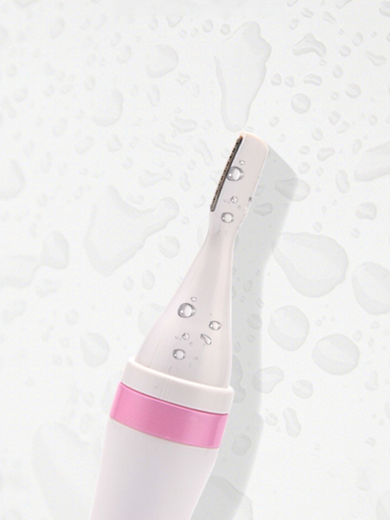 Pink 4-in-1 nose hair trimmer from Trendsi with multiple attachments for grooming nose, ear, and facial hair.
