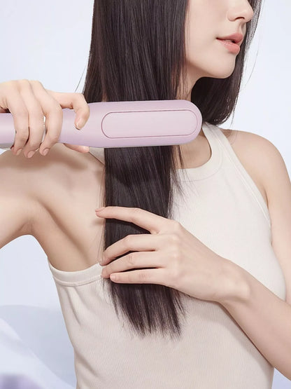 Pink Trendsi fast heating straightening comb with a sleek design for easy hair styling and smooth results.