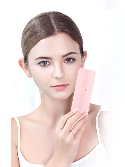 Pink portable facial beauty device by Trendsi, compact and handheld for skincare and facial treatments.