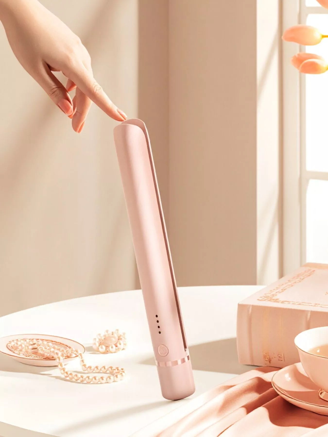 Pink portable hair straightener by Trendsi, compact design with ceramic plates for quick styling on the go.