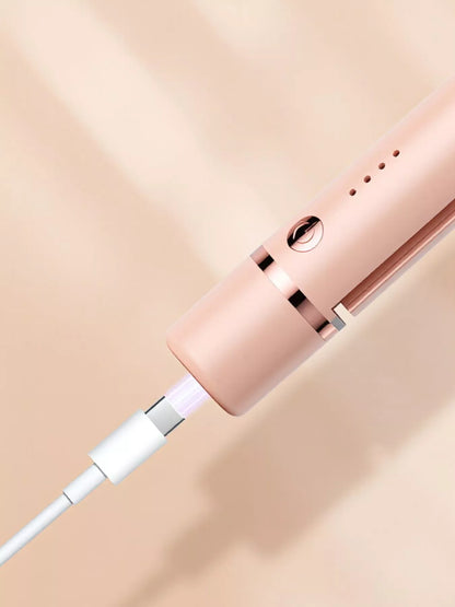 Pink Trendsi portable hair straightener with compact design and ceramic plates for quick, easy styling on the go.