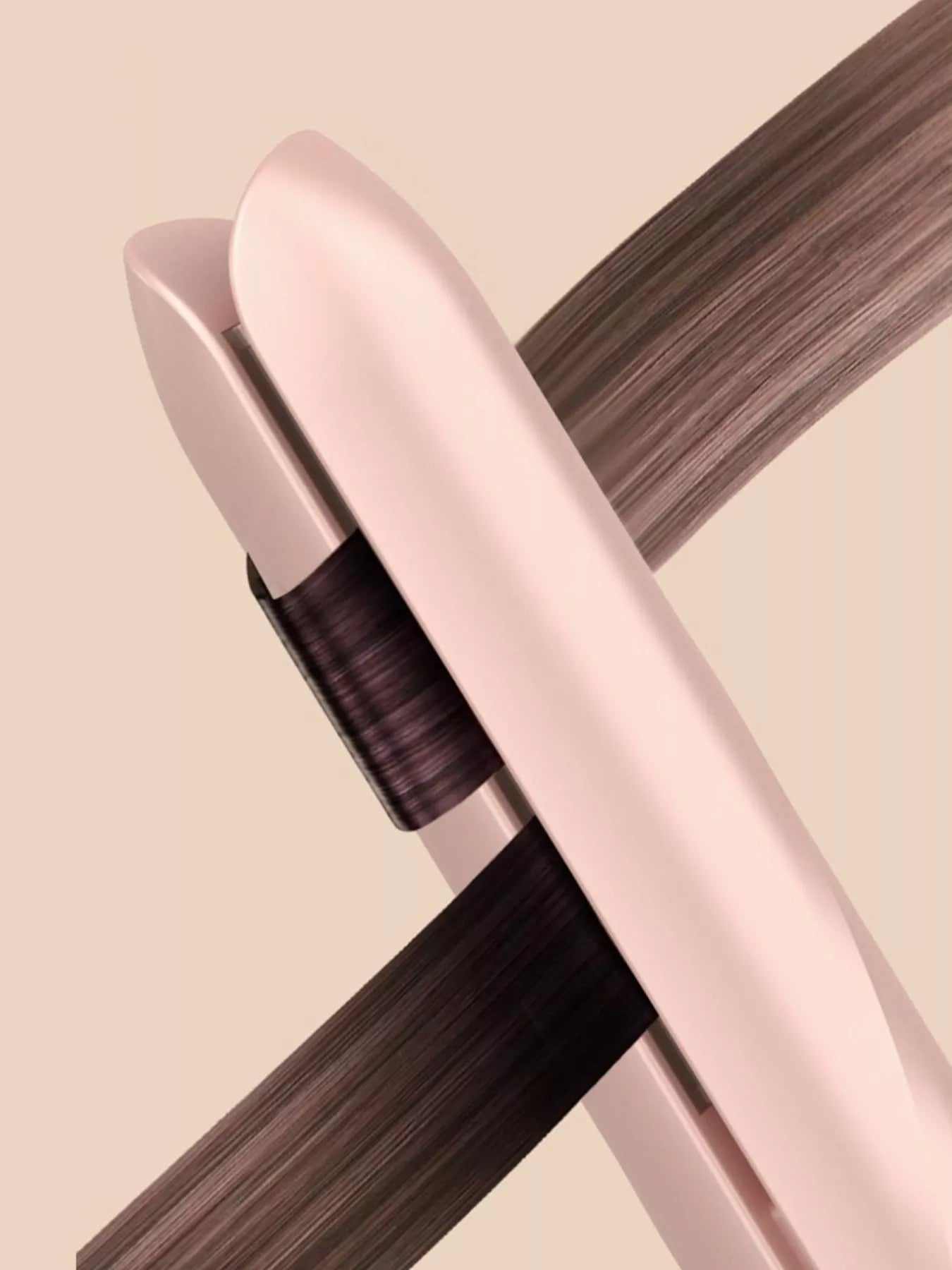 Pink portable hair straightener from Trendsi with compact design and ceramic plates for quick styling on the go.