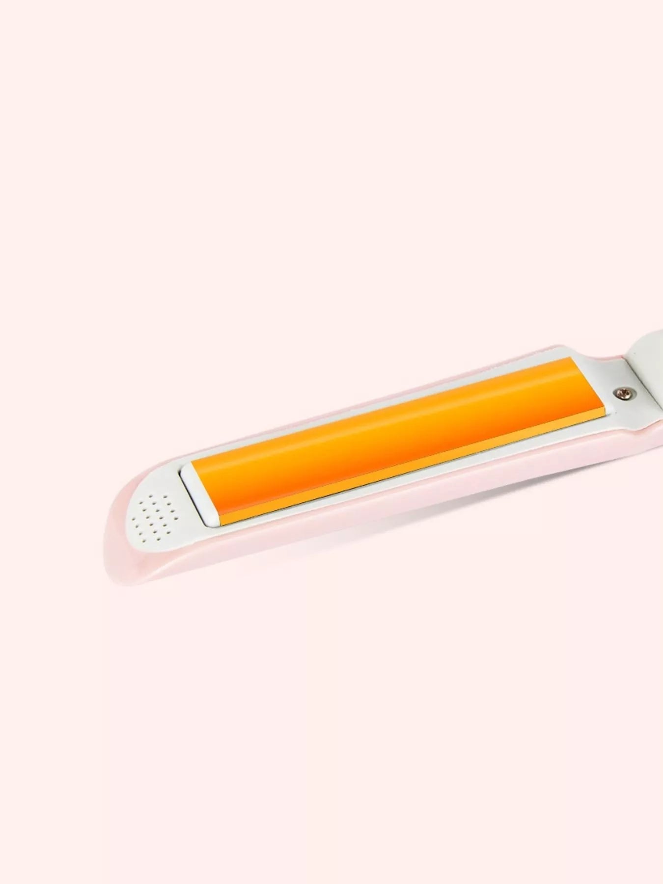 Pink portable hair straightener by Trendsi with a sleek design, ideal for quick styling on the go.