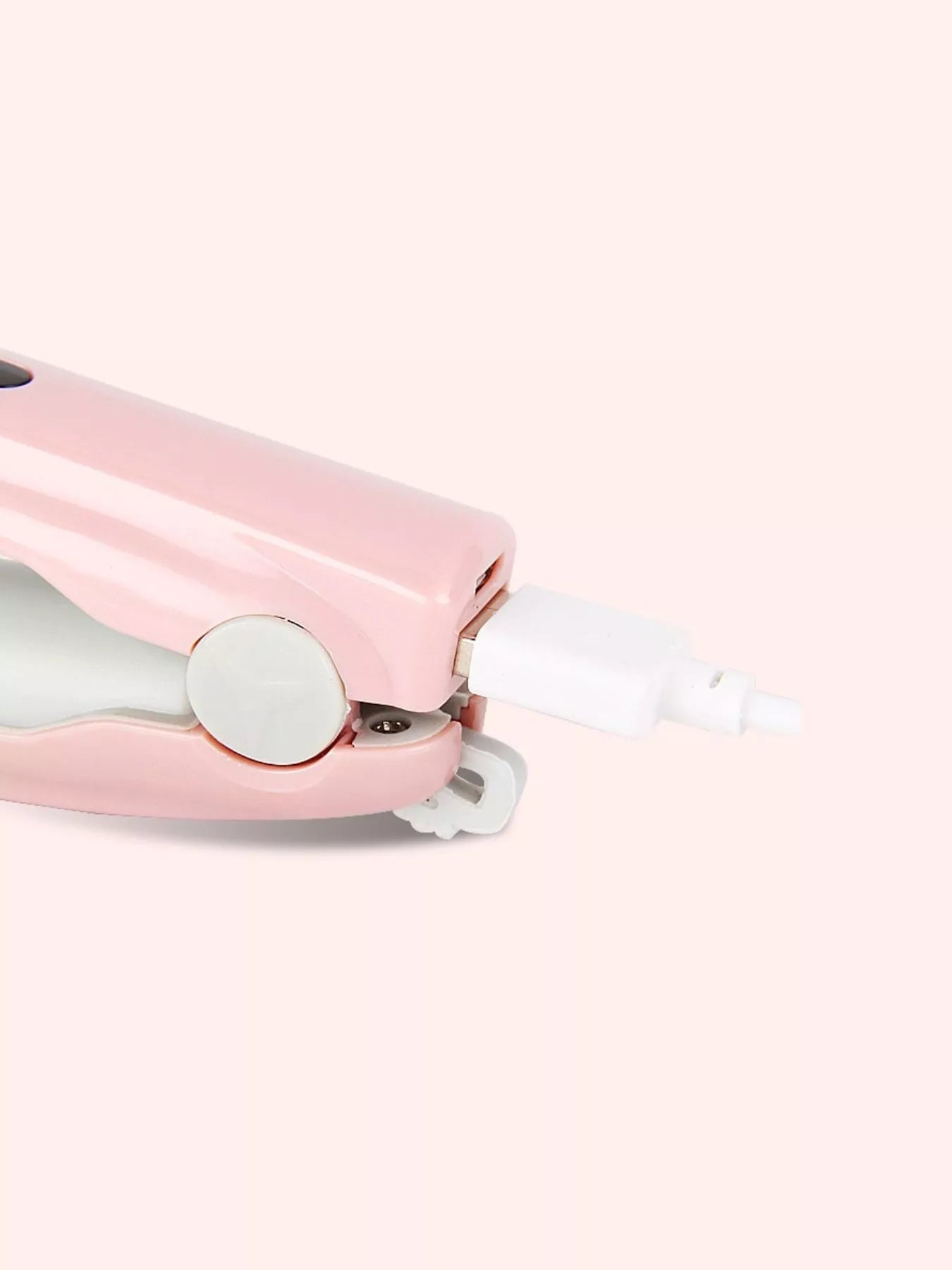 Pink portable hair straightener by Trendsi, compact and lightweight for on-the-go styling.