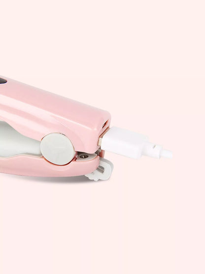 Pink portable hair straightener by Trendsi, compact and lightweight for on-the-go styling.