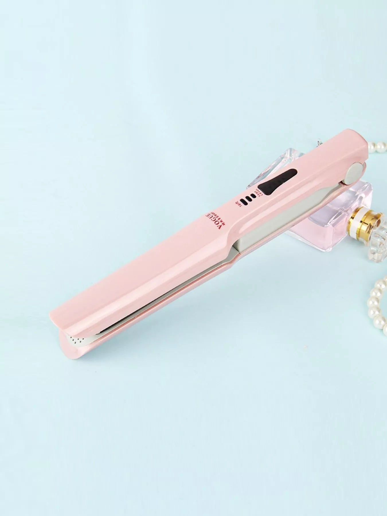 Pink portable hair straightener by Trendsi with compact design, ideal for quick styling on the go.