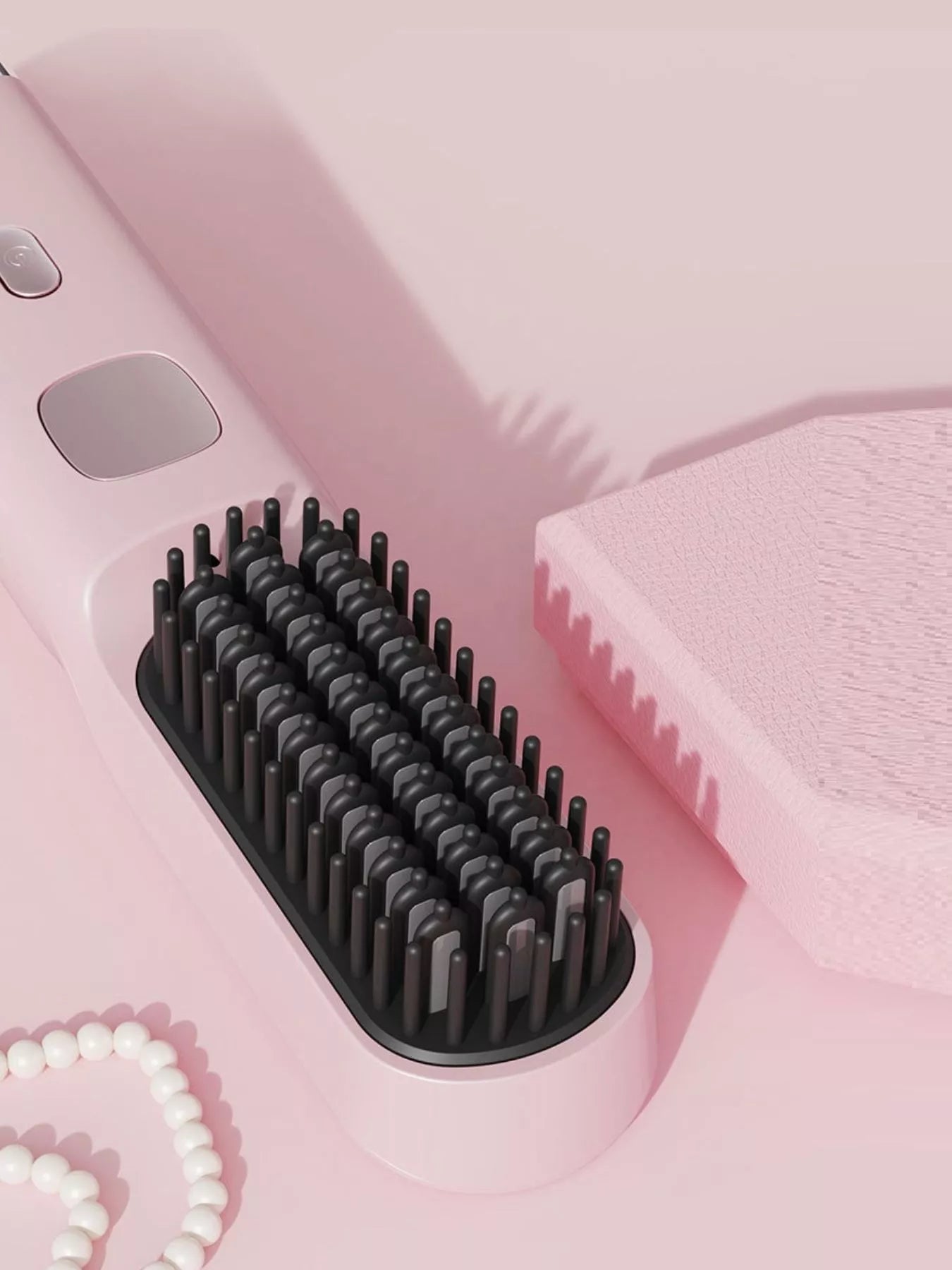 Pink portable heated hair straightening comb by Trendsi, with ceramic plates and ergonomic handle for easy styling.