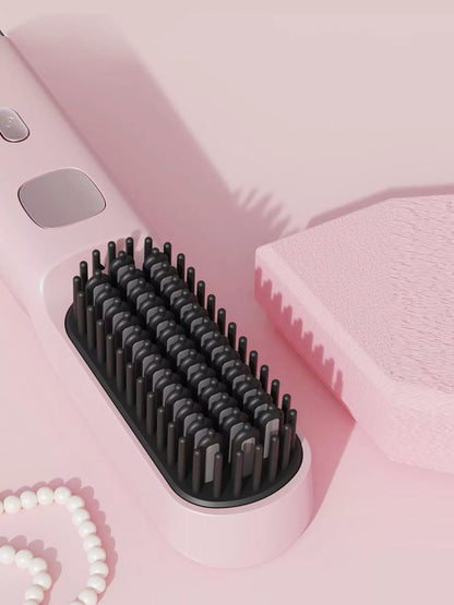 Pink portable heated hair straightening comb by Trendsi, with ceramic plates and ergonomic handle for easy styling.