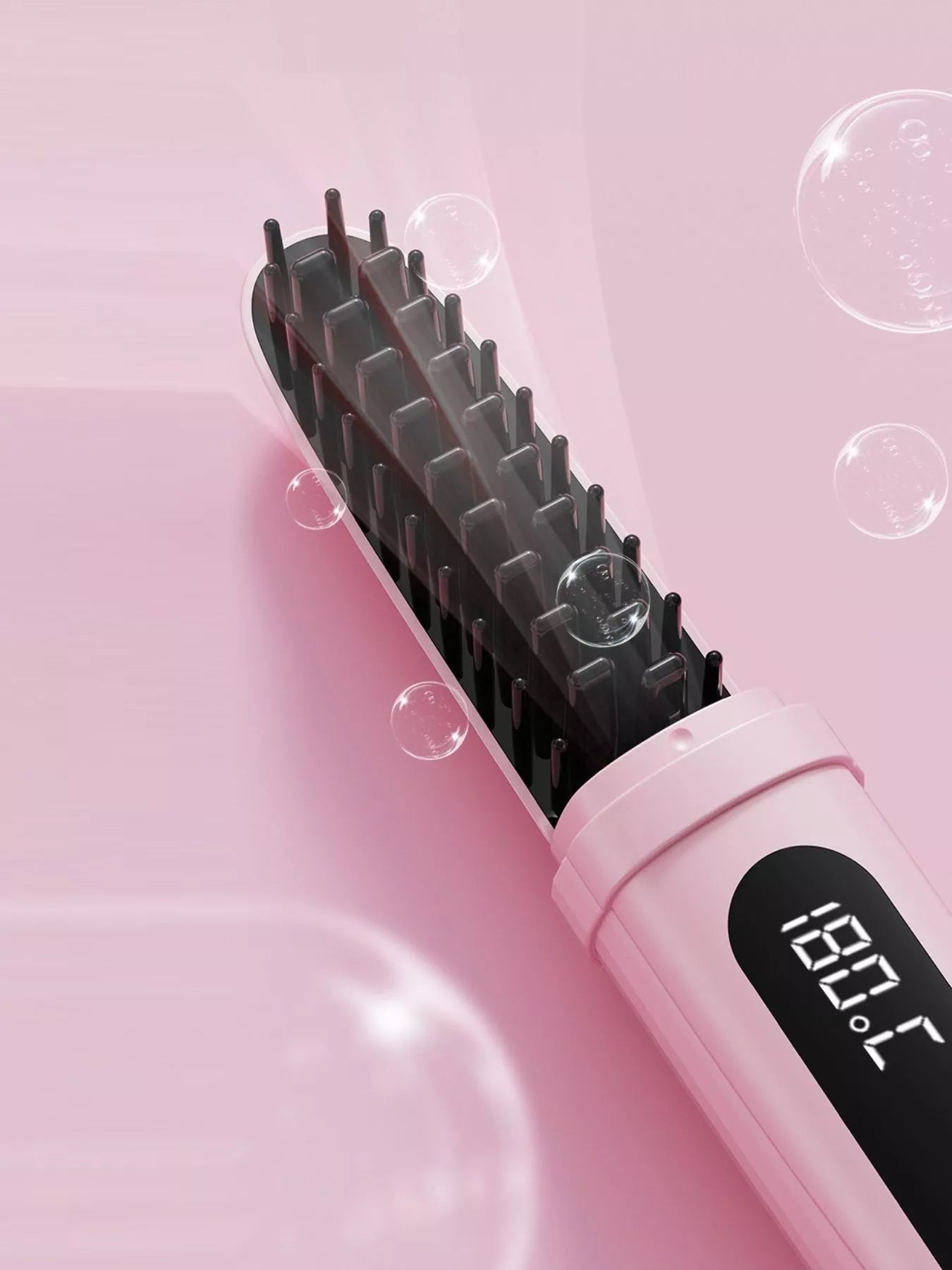 Pink portable heated straightening comb by Trendsi, compact design for easy styling and straightening of hair on the go.