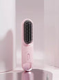 Pink portable heated straightening comb by Trendsi with adjustable temperature control for easy, on-the-go hair styling.
