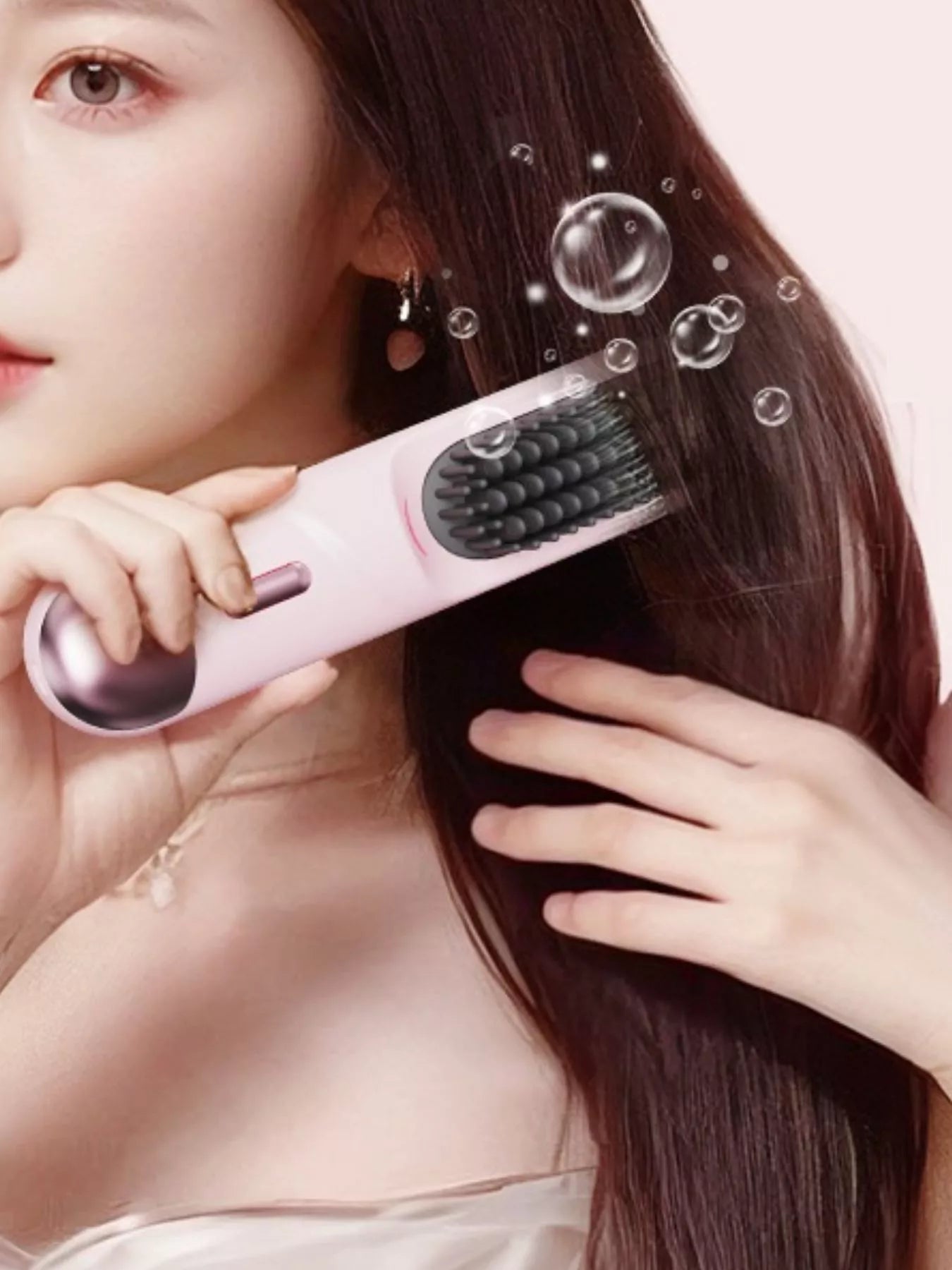 Pink portable heated straightening comb with adjustable temperature control, designed for easy hair styling on the go.