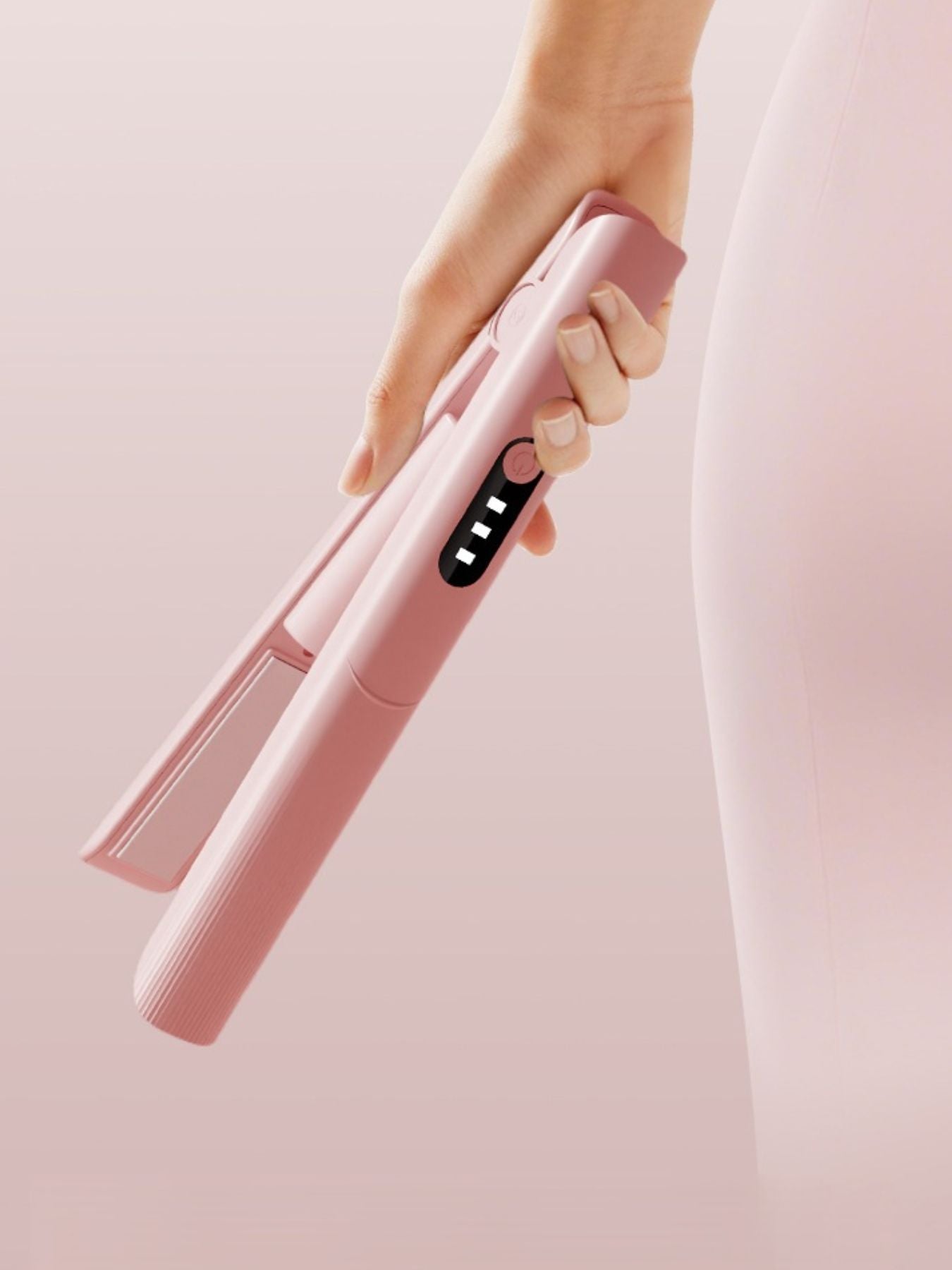 Pink rechargeable hair straightener by Trendsi, compact design with ceramic plates for smooth, sleek styling.