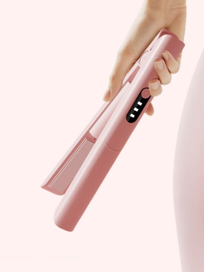Pink rechargeable hair straightener from Trendsi, compact and sleek design for easy styling on the go.