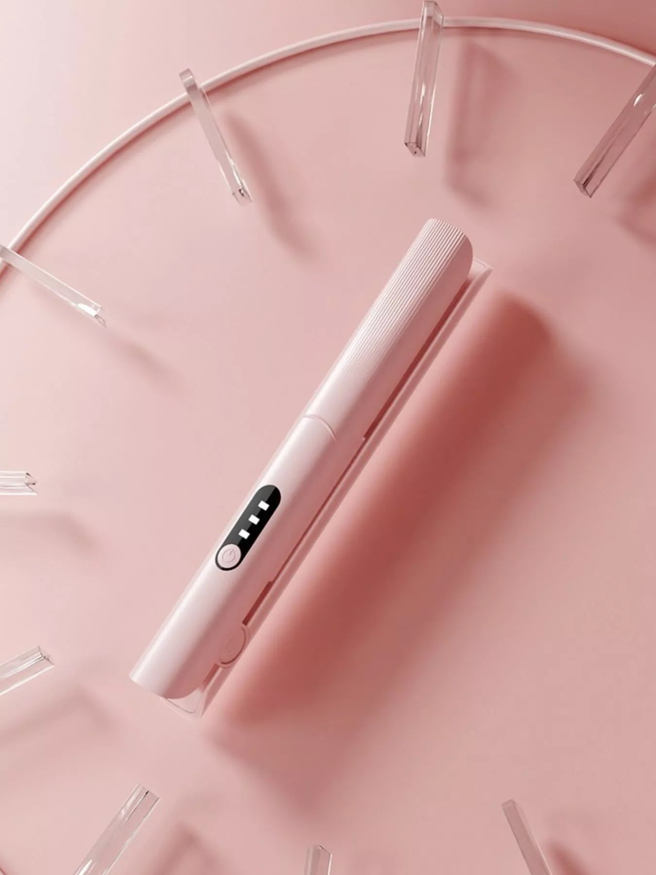 Pink rechargeable hair straightener from Trendsi, compact and sleek for easy styling on the go.