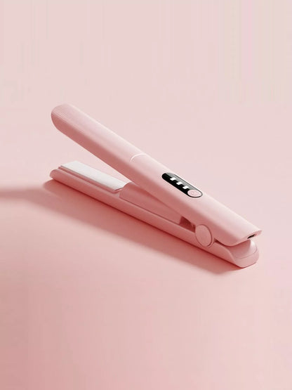 Pink rechargeable hair straightener from Trendsi with sleek design and ceramic plates for smooth, straight hair styling.