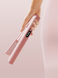Pink Trendsi rechargeable hair straightener with sleek design and ceramic plates for smooth, straight hair.