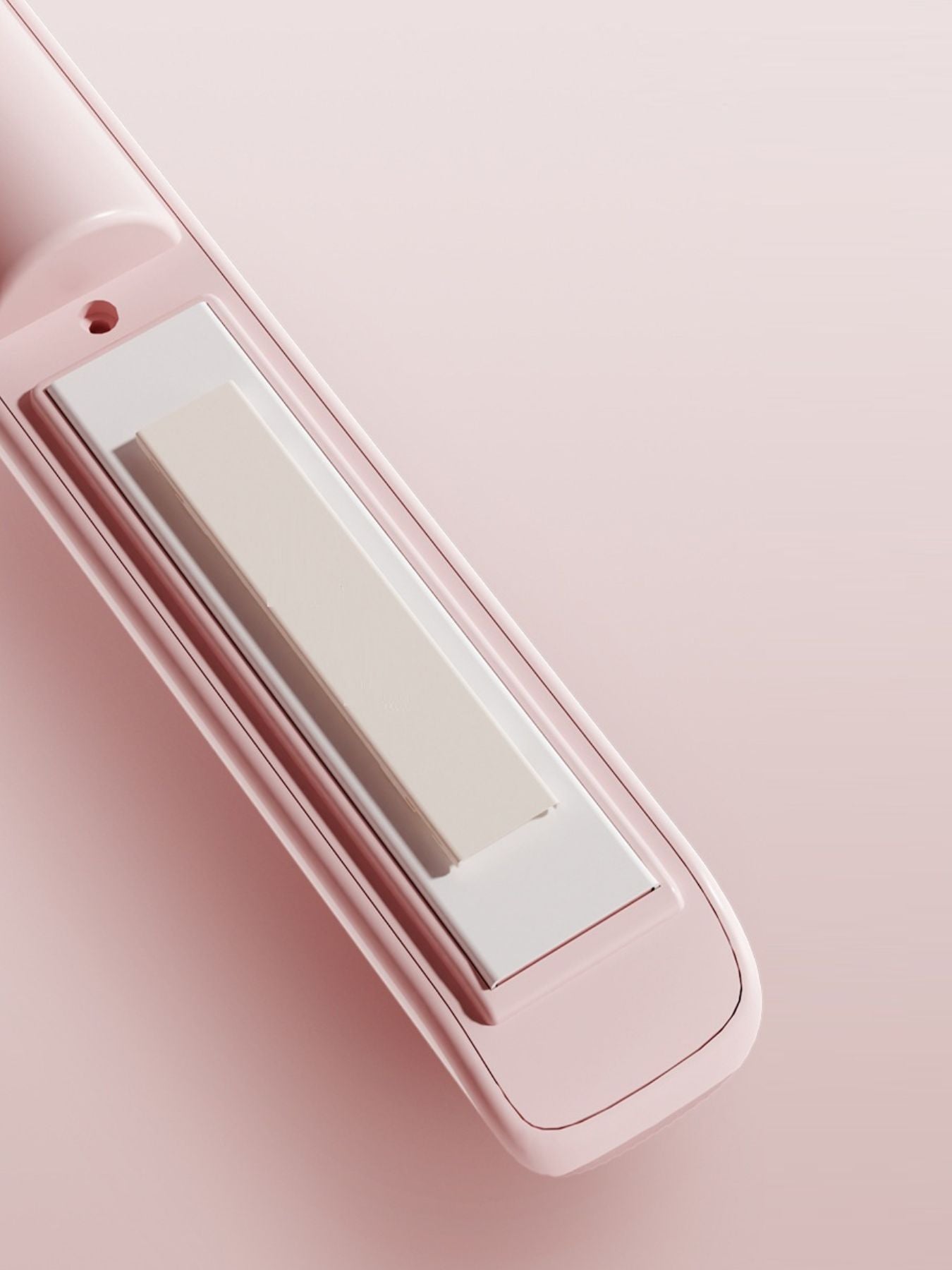 Pink rechargeable hair straightener by Trendsi with sleek design and ceramic plates for smooth, straight hair styling.
