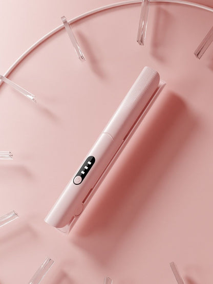 Pink rechargeable hair straightener by Trendsi with a sleek design and compact size, perfect for on-the-go styling.