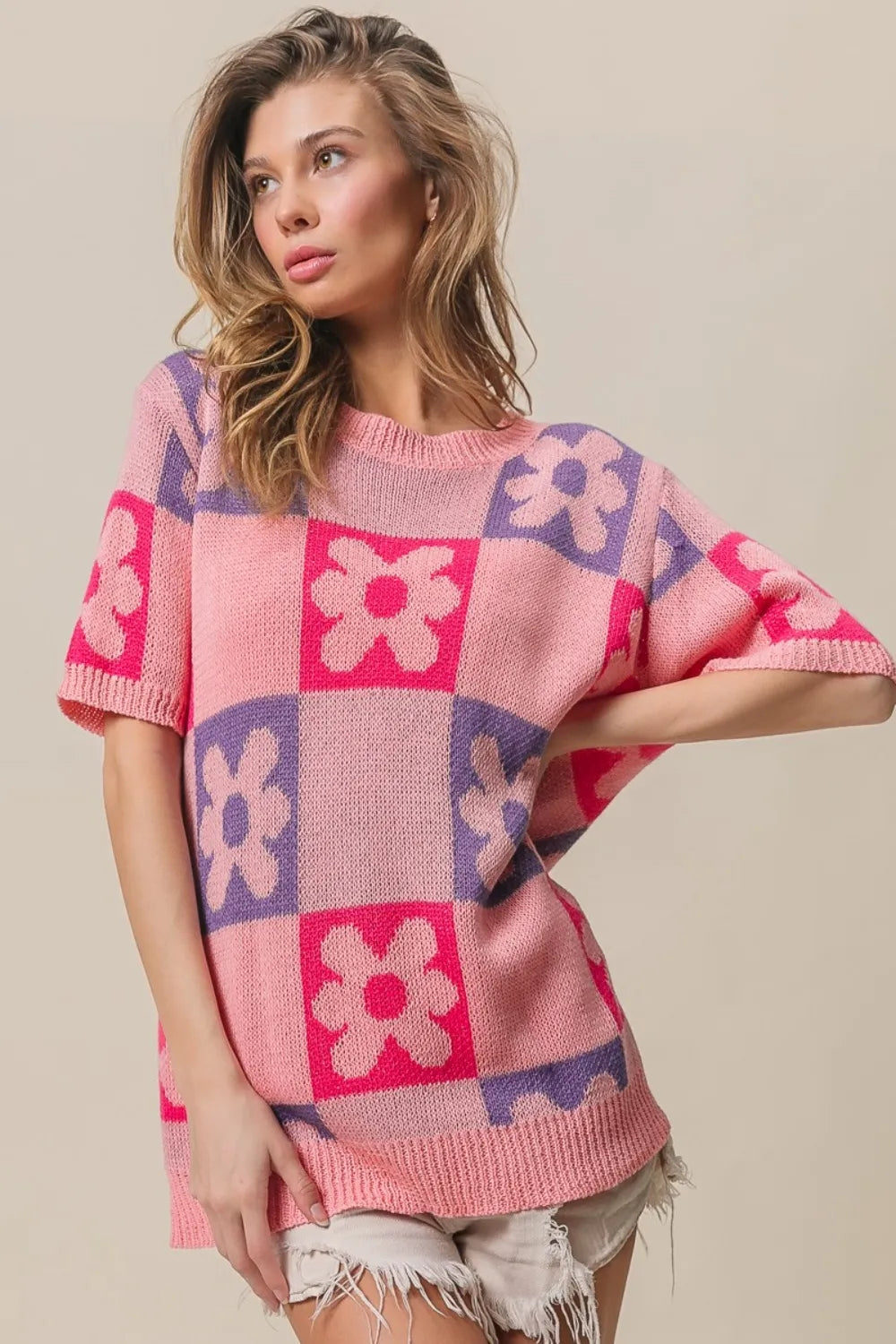 Pink and fuchsia BiBi Flower checker pattern short sleeve sweater by Trendsi, featuring a colorful floral and checker design.