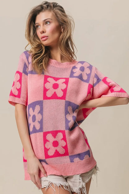 Pink and fuchsia BiBi Flower checker pattern short sleeve sweater by Trendsi, featuring a colorful floral and checker design.