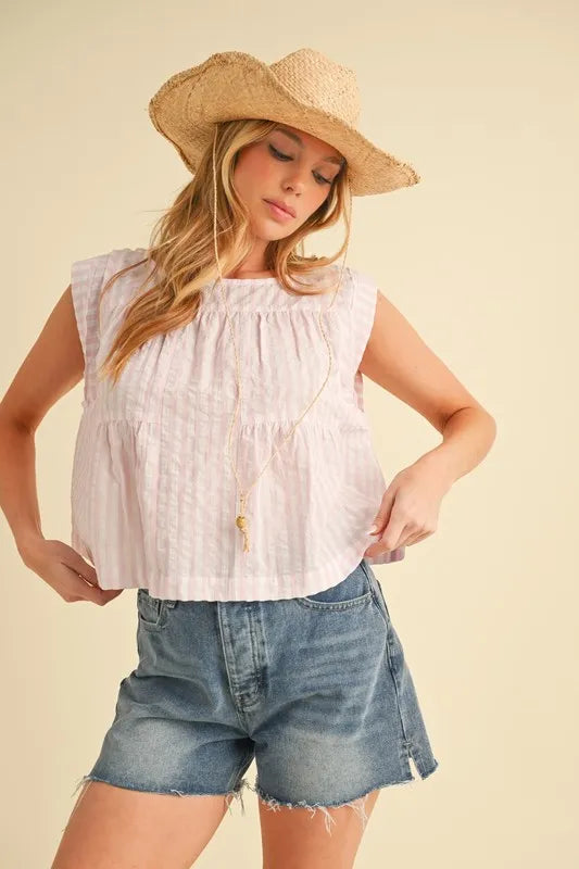 Pink Aemi+Co sleeveless top with ruched striped design and round neckline, stylish women’s fashion from Trendsi.