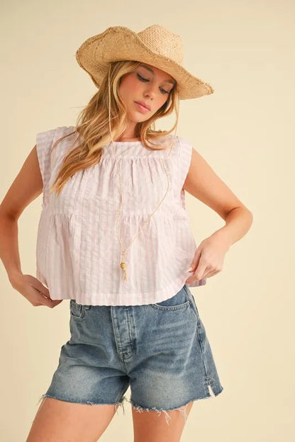 Pink Aemi+Co sleeveless top with ruched striped design and round neckline, stylish women’s fashion from Trendsi.