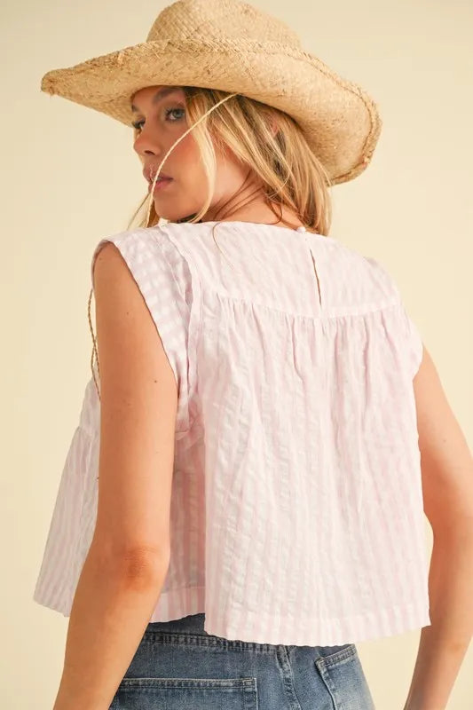 Pink Aemi+Co sleeveless striped top with ruched detail and round neckline, perfect for casual wear.