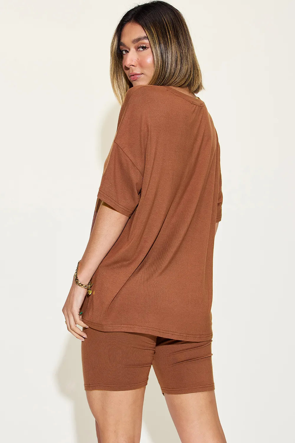 Pink Basic Bae full-size V-neck drop shoulder T-shirt and shorts set by Trendsi, shown laid out on a flat surface.