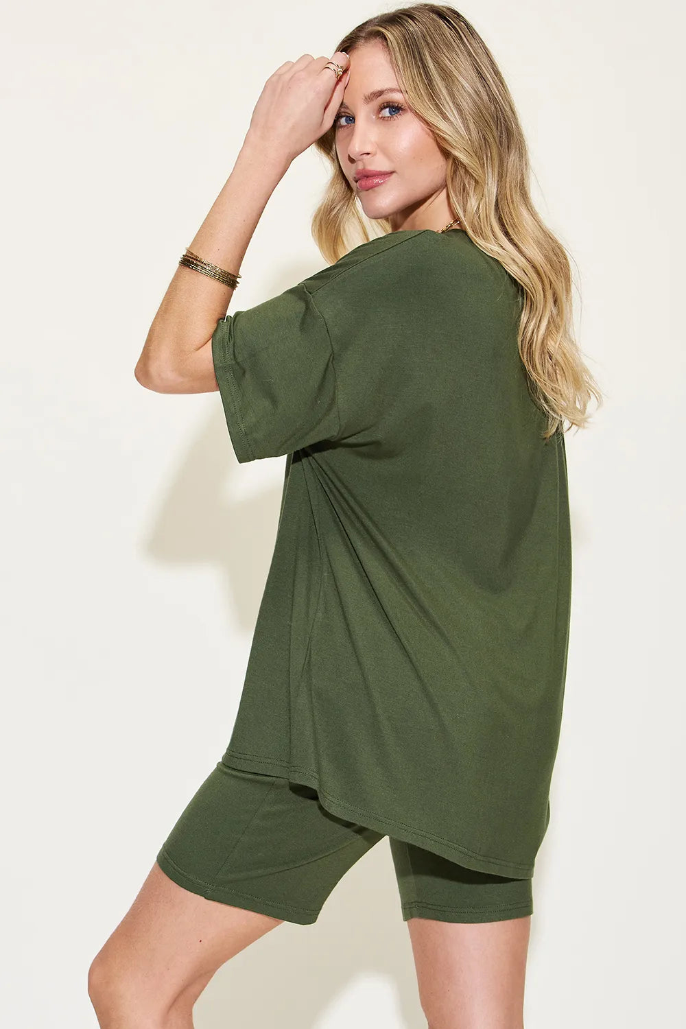 Pink Basic Bae V-neck drop shoulder T-shirt and shorts set by Trendsi, casual loungewear with relaxed fit and comfortable style.