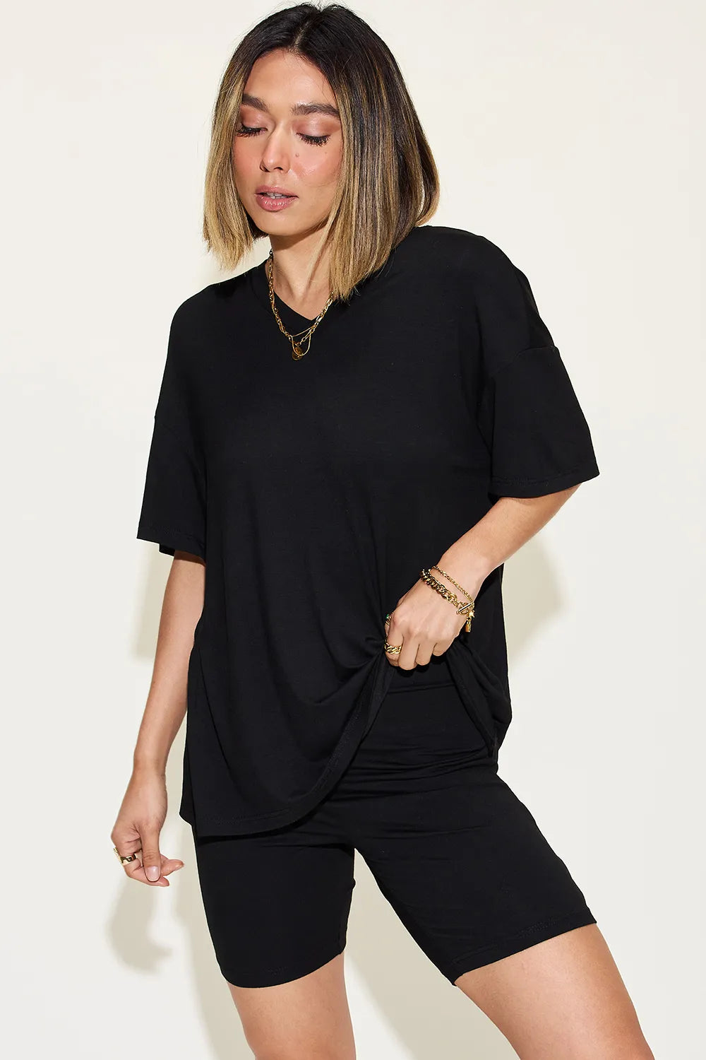 Pink Trendsi Basic Bae V-neck drop shoulder T-shirt and shorts set, casual and comfortable, displayed on a flat lay.